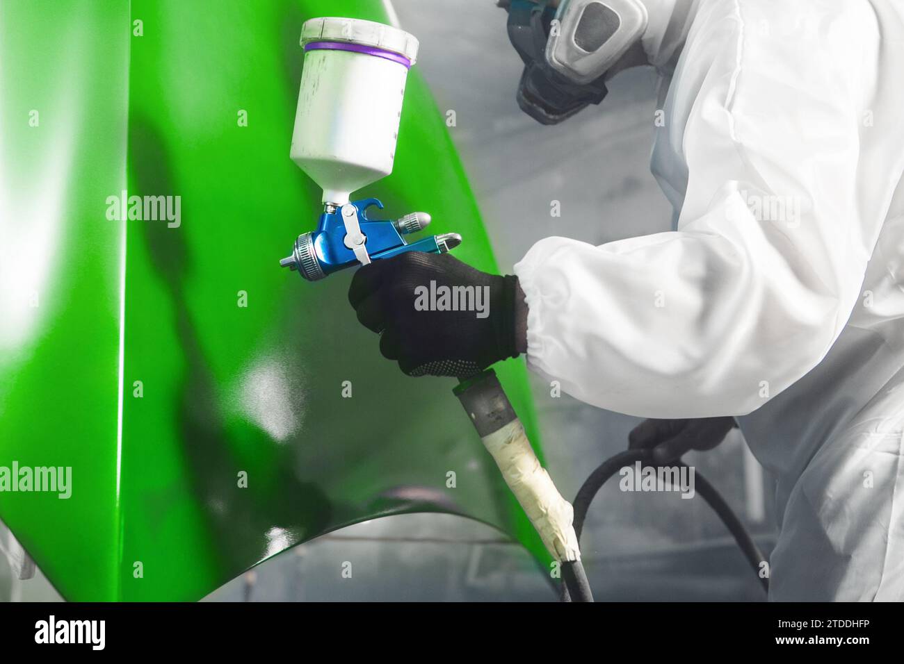 Car paint job by professional worker, car painting procedure in car