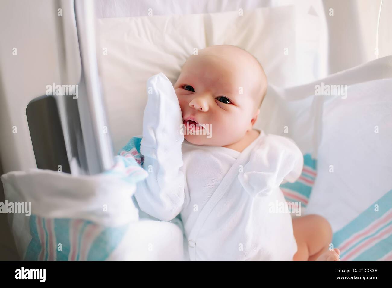 newborn baby in the hospital bassinet Stock Photo
