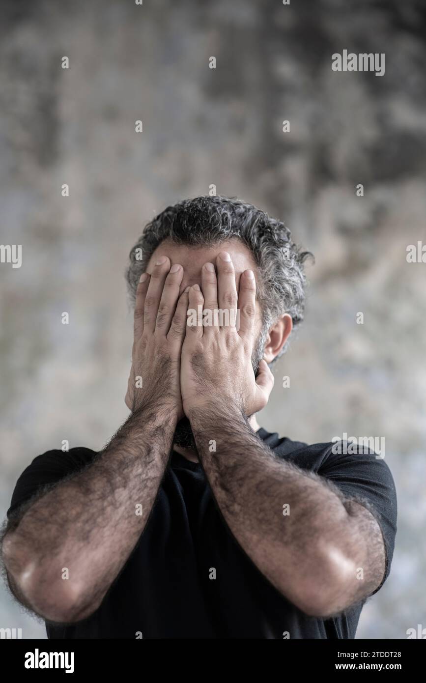 Stressed man head in hands Stock Photo