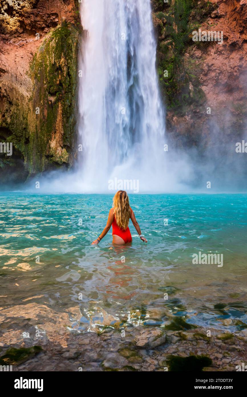 Woman Swimming at Mooney Falls in Arizona Stock Photo