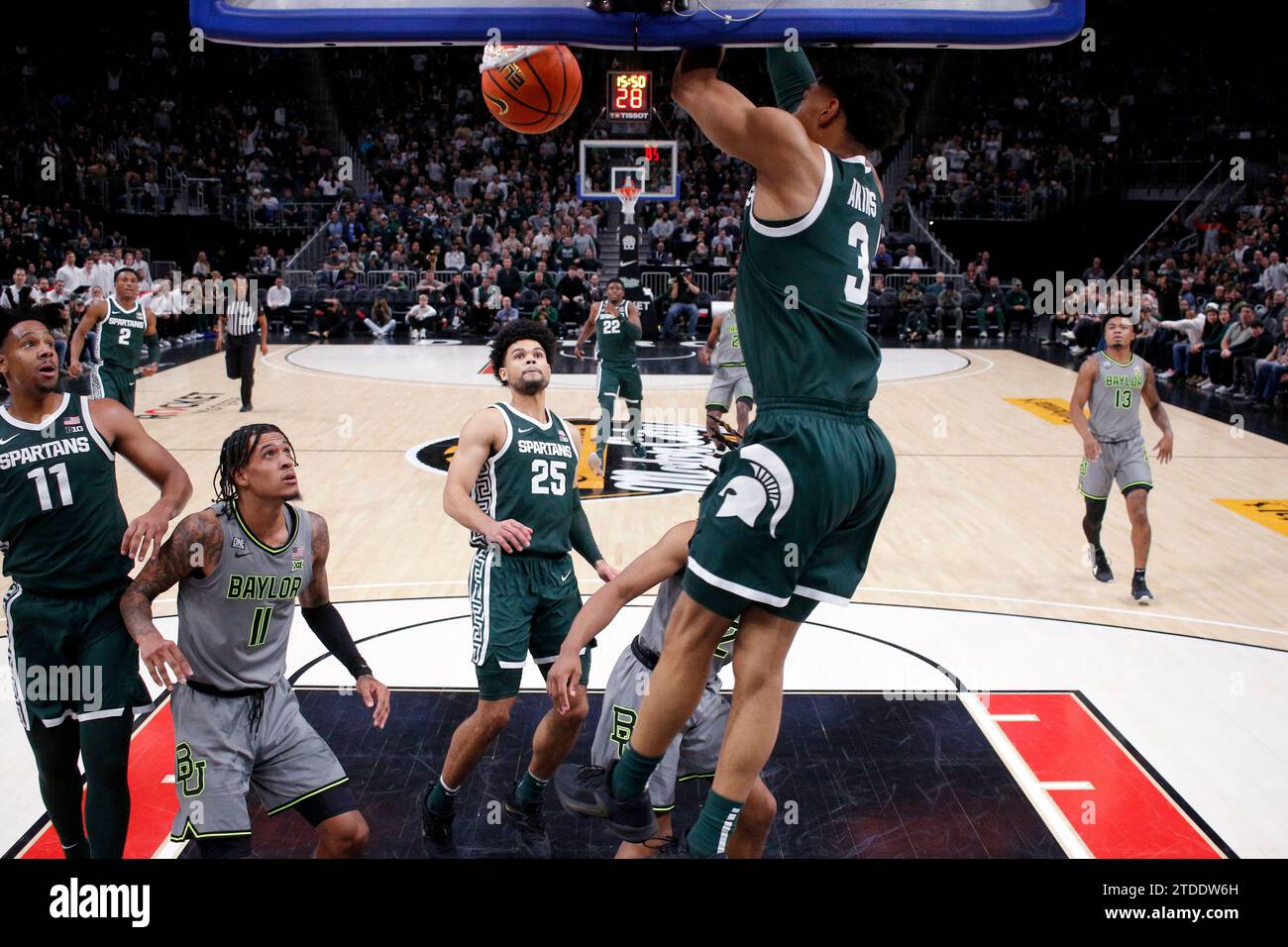 Michigan State guard Jaden Akins (3) dunks over Baylor forward Jalen ...