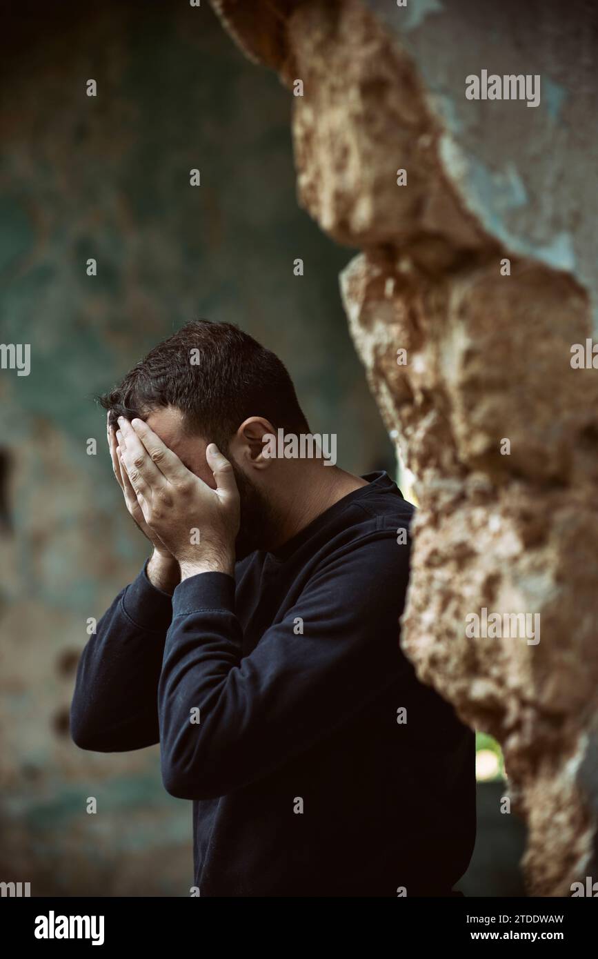 Stressed man head in hands Stock Photo
