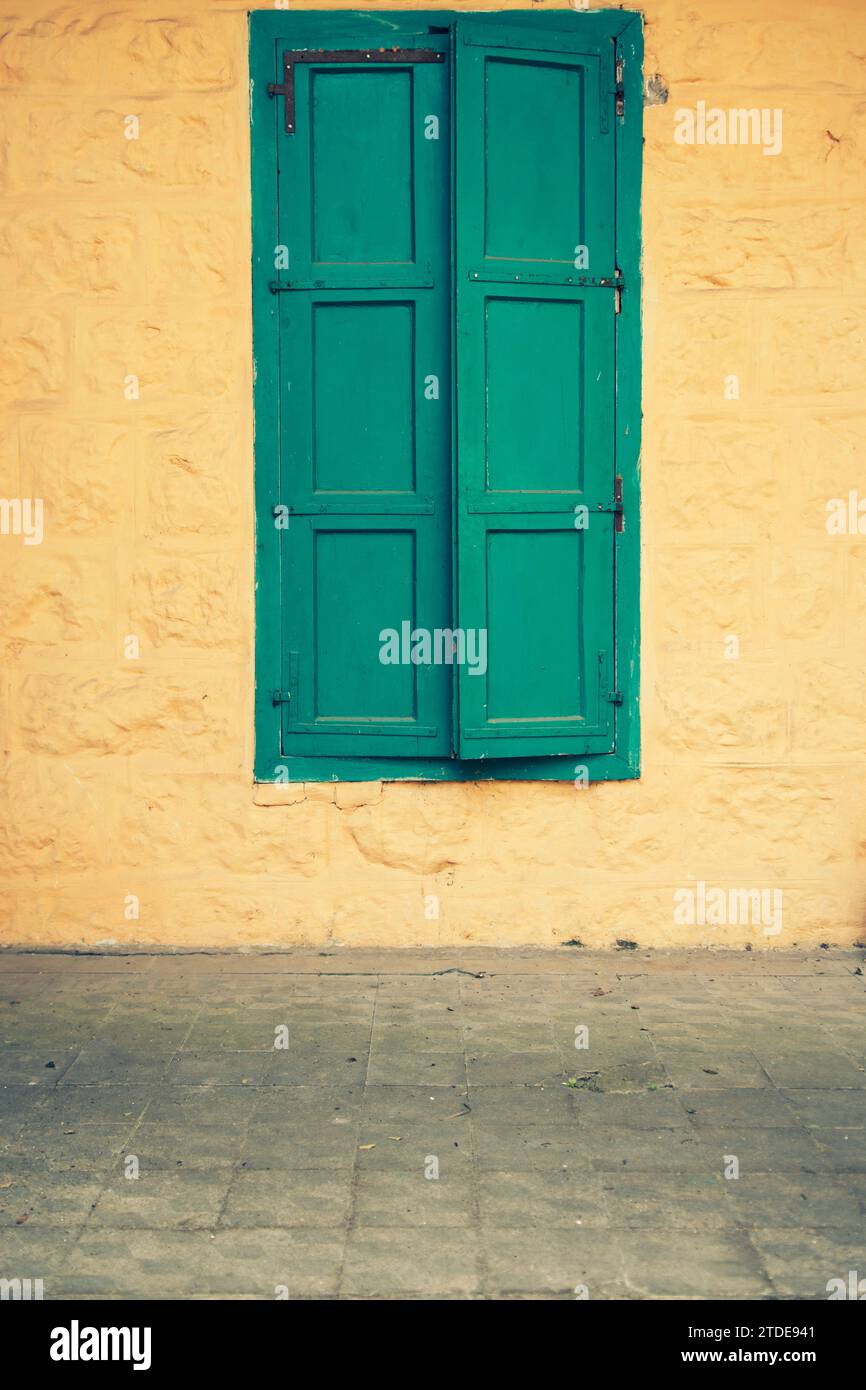Old fashioned green shutters Stock Photo