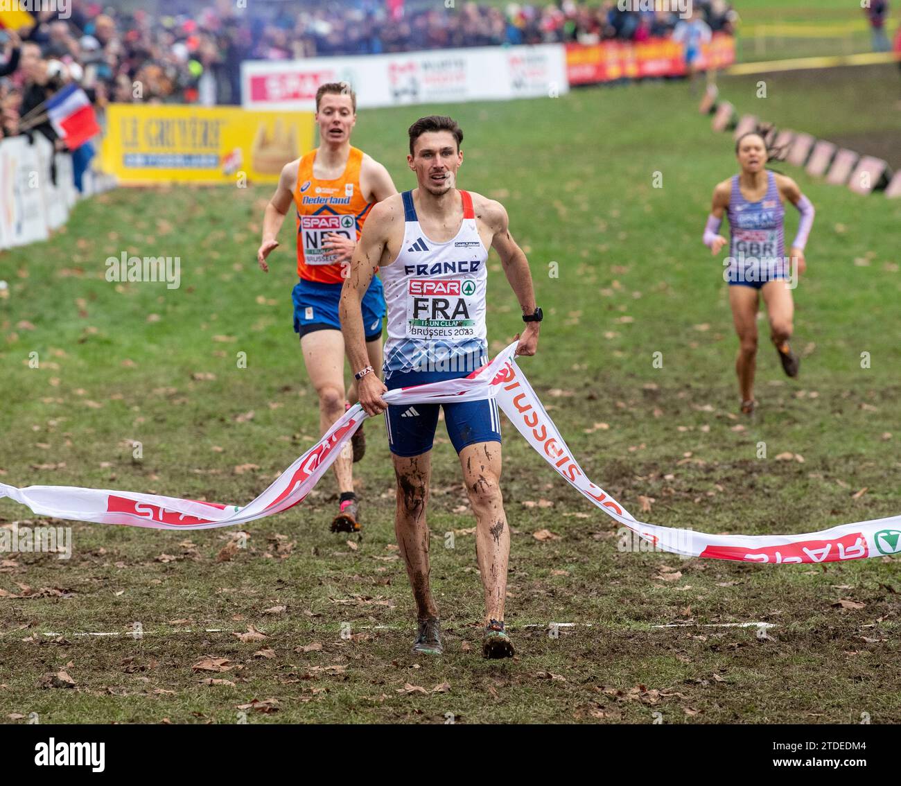 Alexis Miellet of France crosses the finishing line to help his team