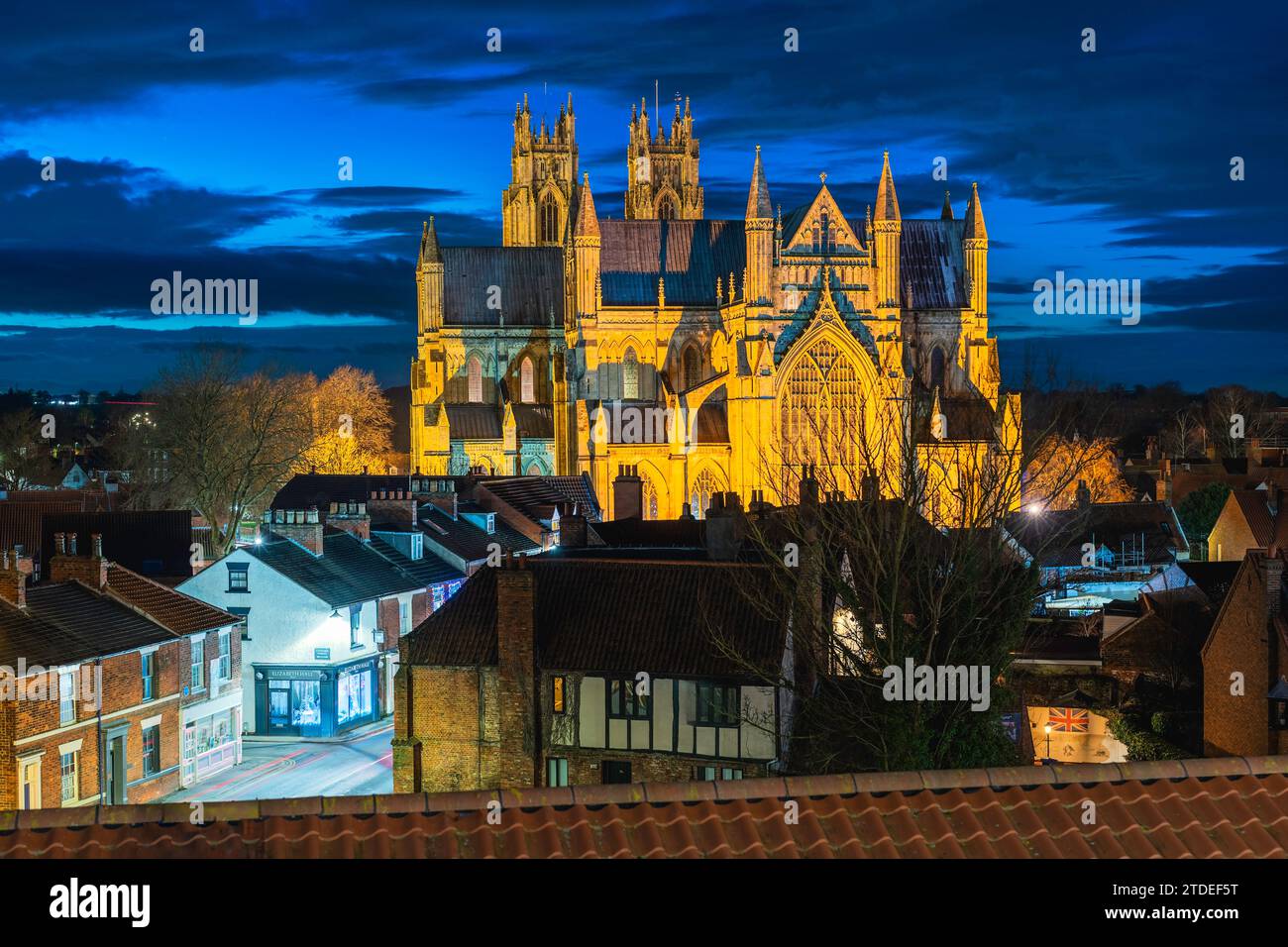 Night time view of ancient Beverley minster from elevated point in town centre with flood lights in Beverley, UK. Stock Photo