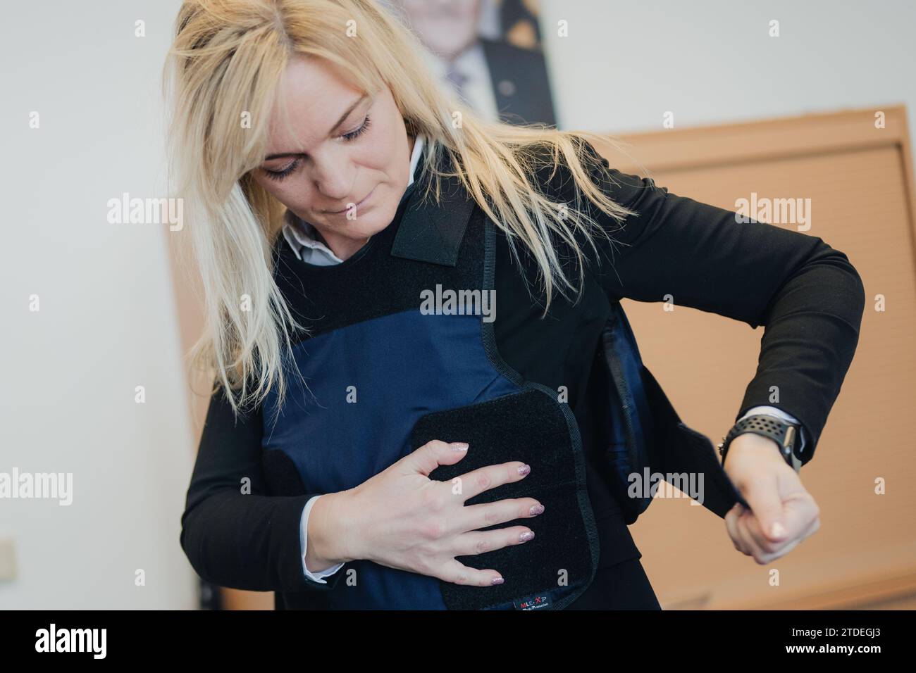 Cologne, Germany. 18th Dec, 2023. Bailiff Papapostolou puts on