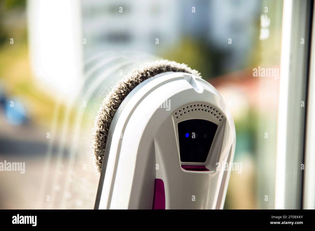 Modern device for cleaning glass from dirt and streaks. Robot washer