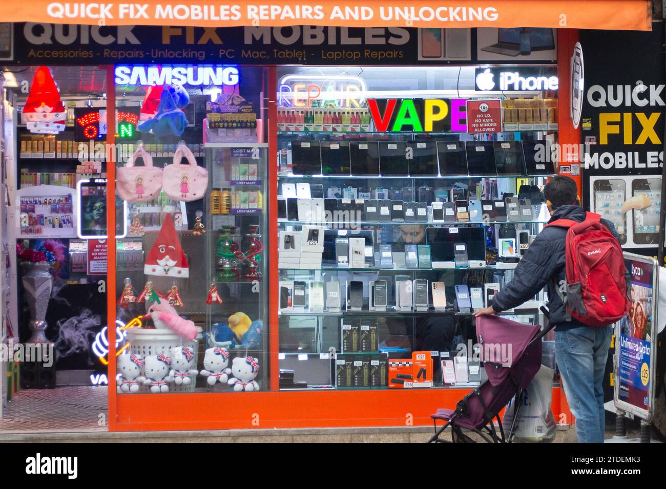 Slough, Berkshire, UK. 16th December, 2023. Vape advertising in a shop in Slough, Berkshire. The World Health Organisation has called for flavoured vapes to be banned worldwide. They have said  that 'urgent measures' are were needed to control e-cigarettes. There are many ex smokers who are now hooked on vaping. Credit: Maureen McLean/Alamy Stock Photo