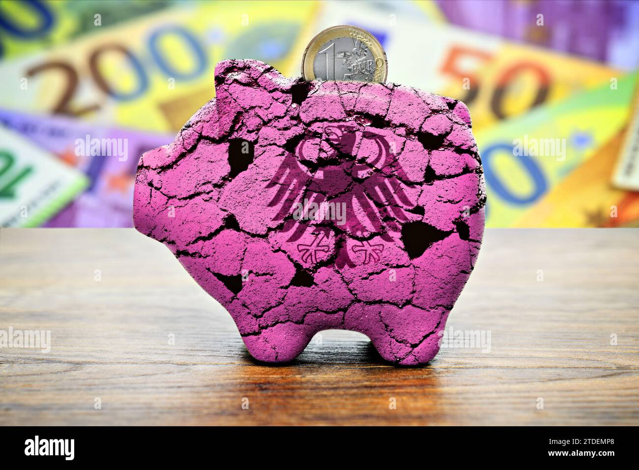 Piggy Bank With Cracks And Federal Eagle, Symbol Photo Federal Budget, Photomontage Stock Photo