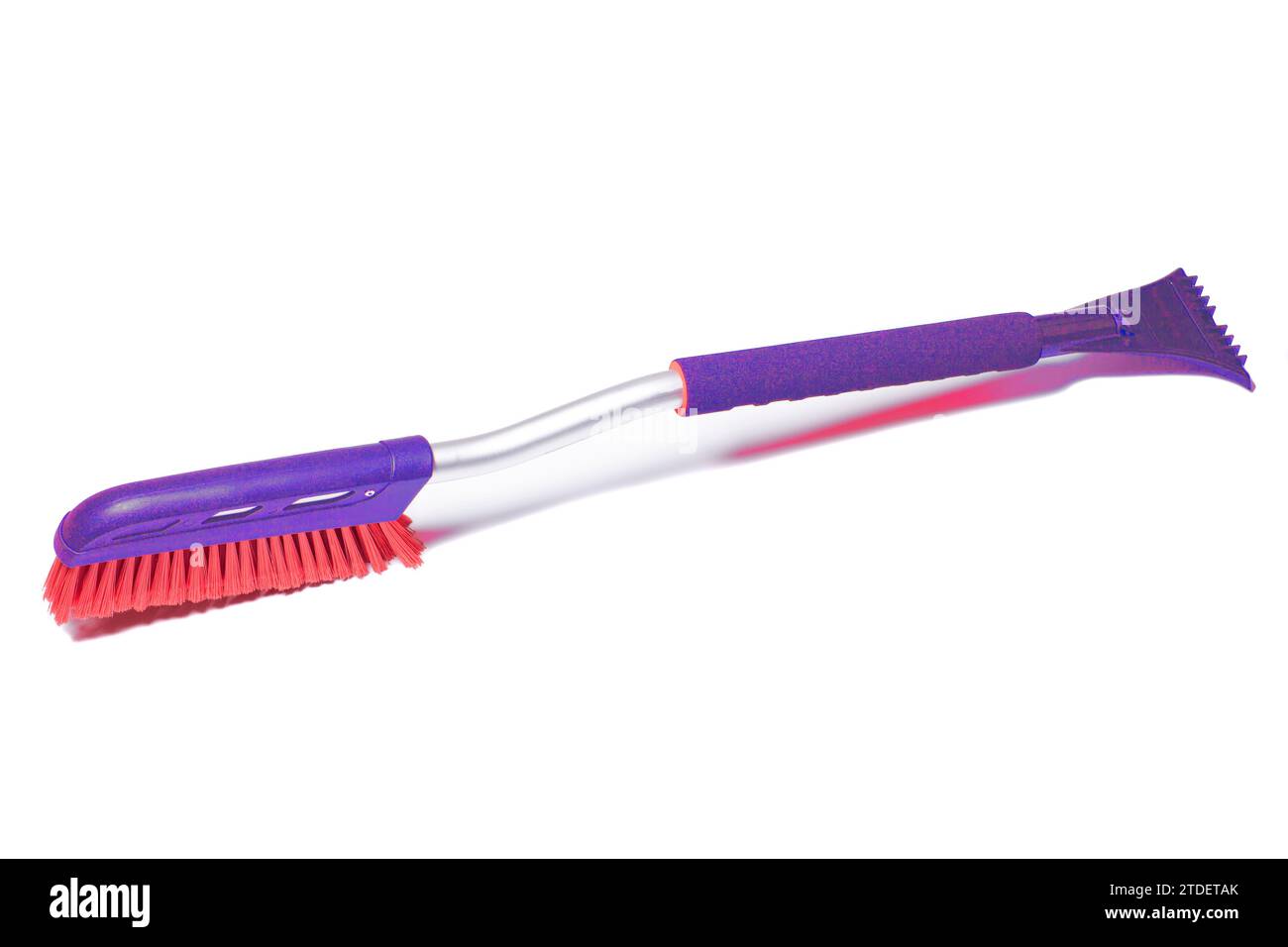 Car brush with a scraper for cleaning the car in winter about snow and