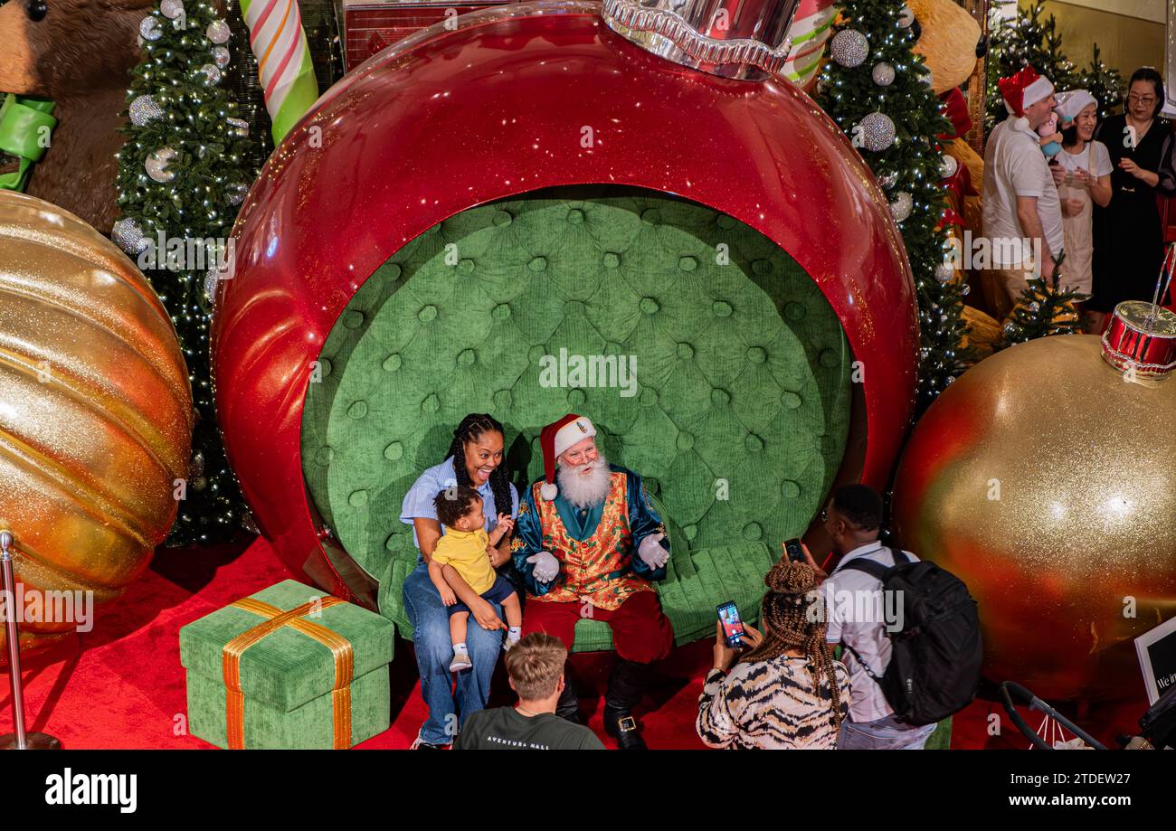 Aventura, Miami, Florida December 17, 2023 Santa Claus at Aventura Mall taking pictures with