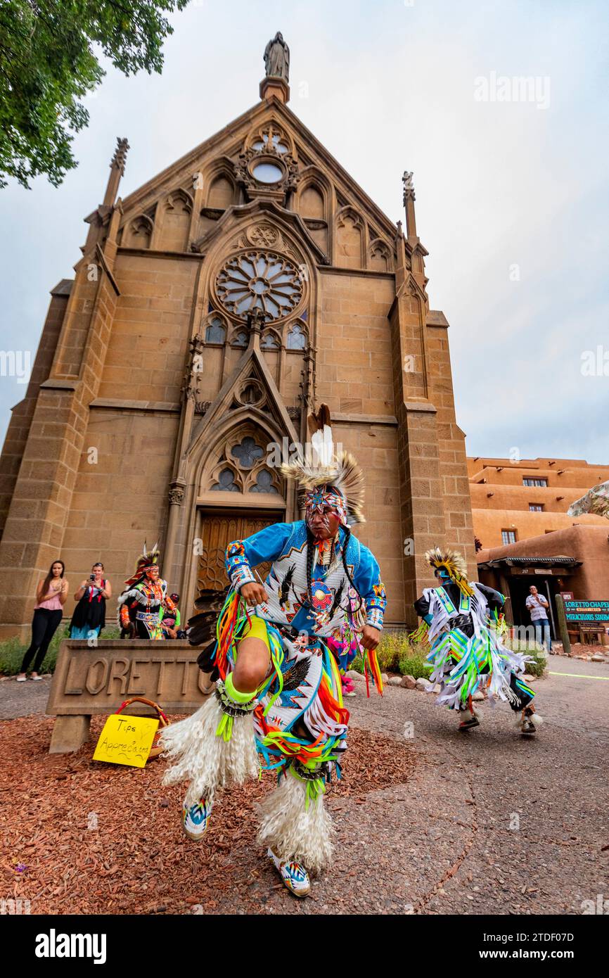 Santa Fe Indian Market participants in traditional regalia perform in downtown Santa Fe, New Mexico, United States of America, North America Stock Photo