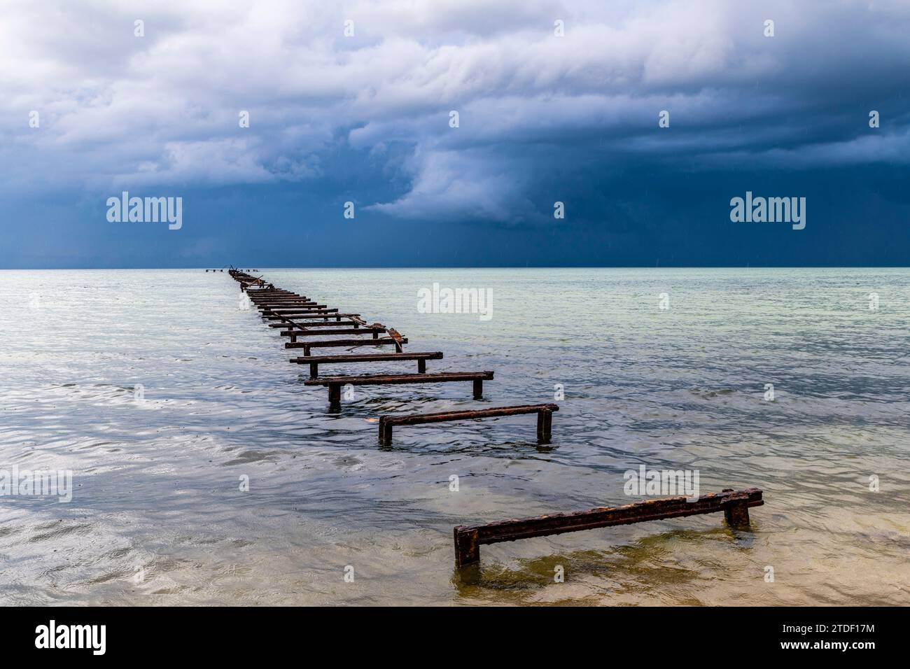 Destroyed pier at a Luxury hotel in Hotel el Colony before a storm, Isla de la Juventud (Isle of Youth), Cuba, West Indies, Central America Stock Photo