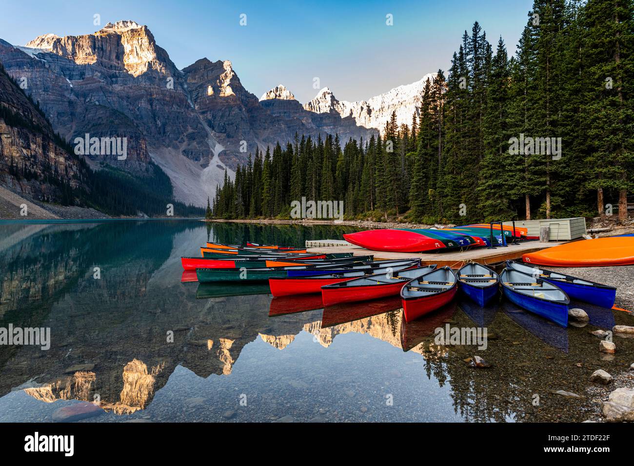 Canoes at sunrise at Lake Moraine, Banff National Park, UNESCO World Heritage Site, Alberta, Rocky Mountains, Canada, North America Stock Photo