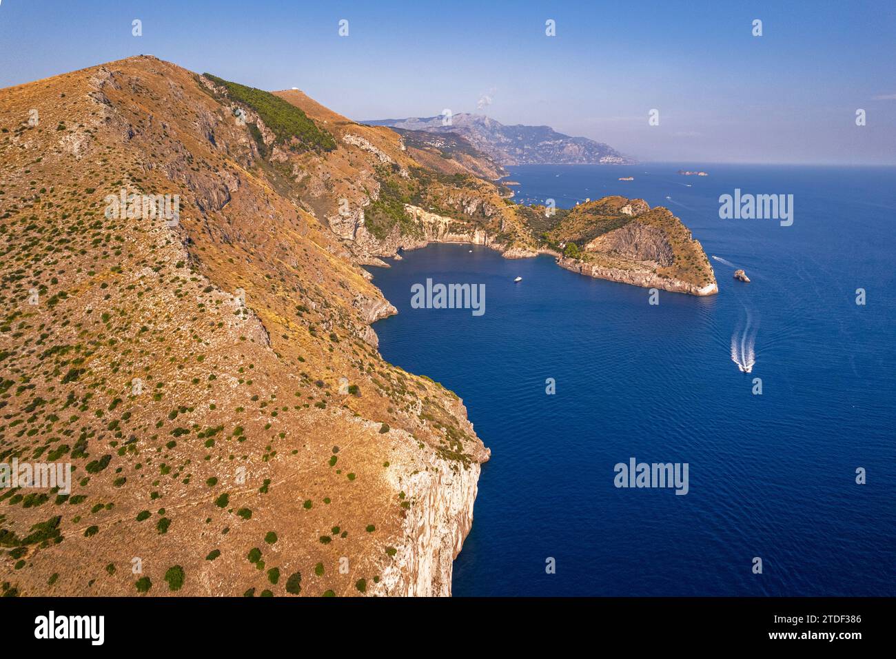Rocky rugged shore of Amalfi coast with Ieranto bay in the foreground, aerial view, Naples province, Campania region, Tyrrhenian Sea, South of Italy Stock Photo