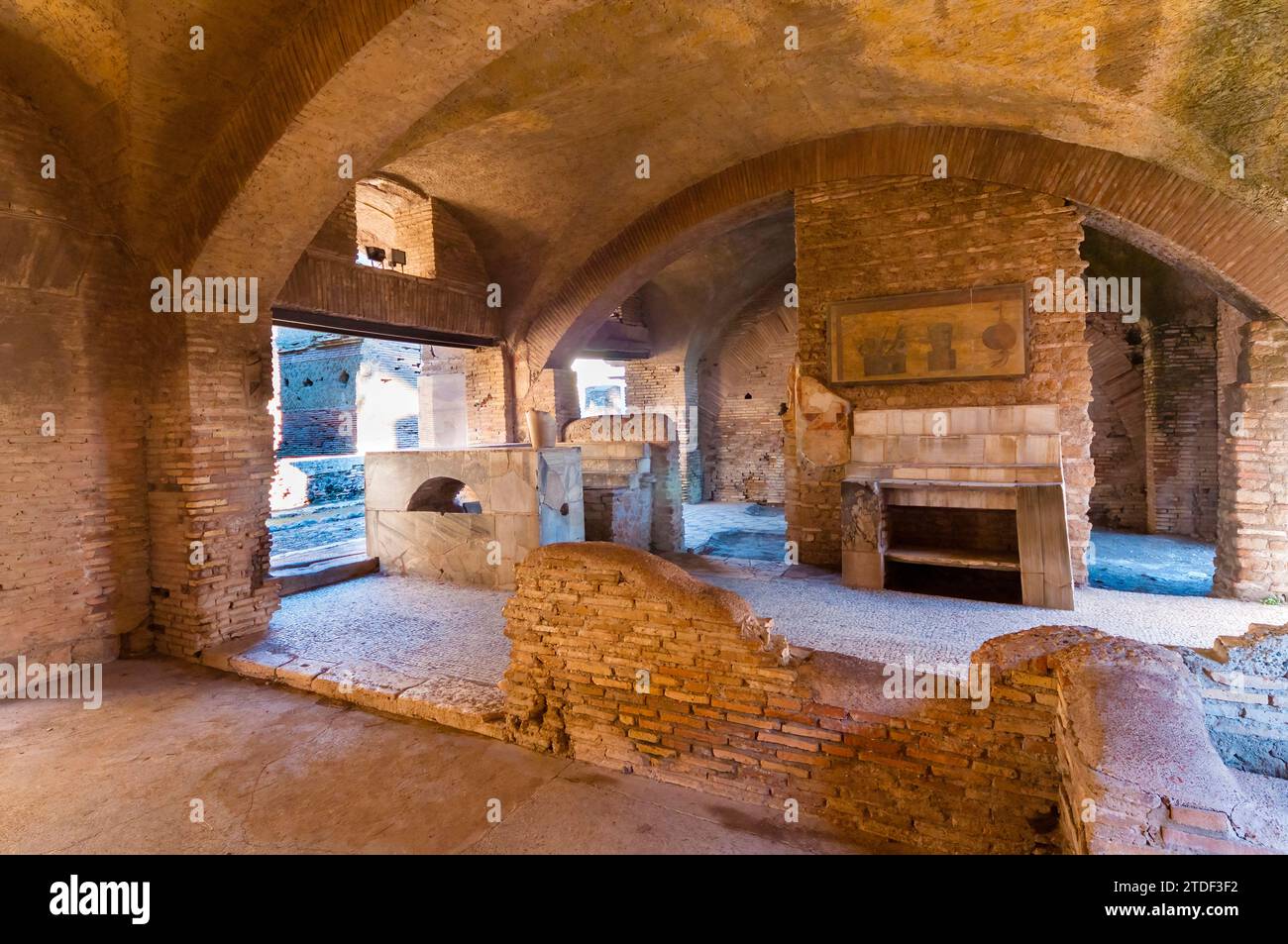 Thermopolium (Roman bar for hot food and drink), Ostia Antica archaeological site, Ostia, Rome province, Latium (Lazio), Italy, Europe Stock Photo