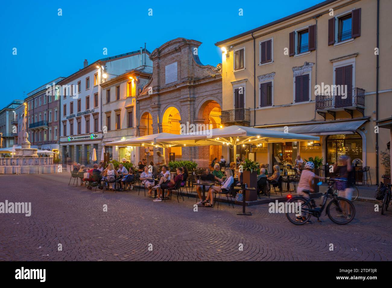 View of restaurant in Piazza Cavour in Rimini at dusk, Rimini, Emilia-Romagna, Italy, Europe Stock Photo