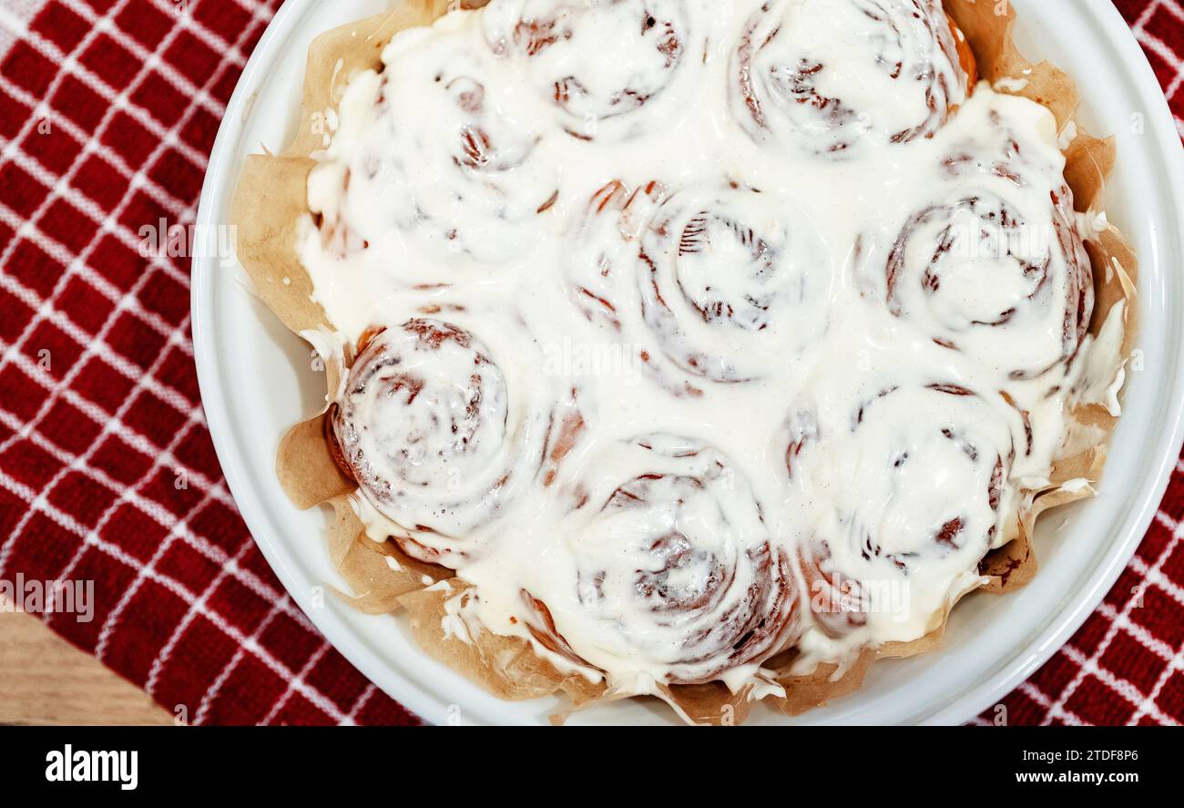 Freshly baked cinnamon rolls with cream cheese. Stock Photo