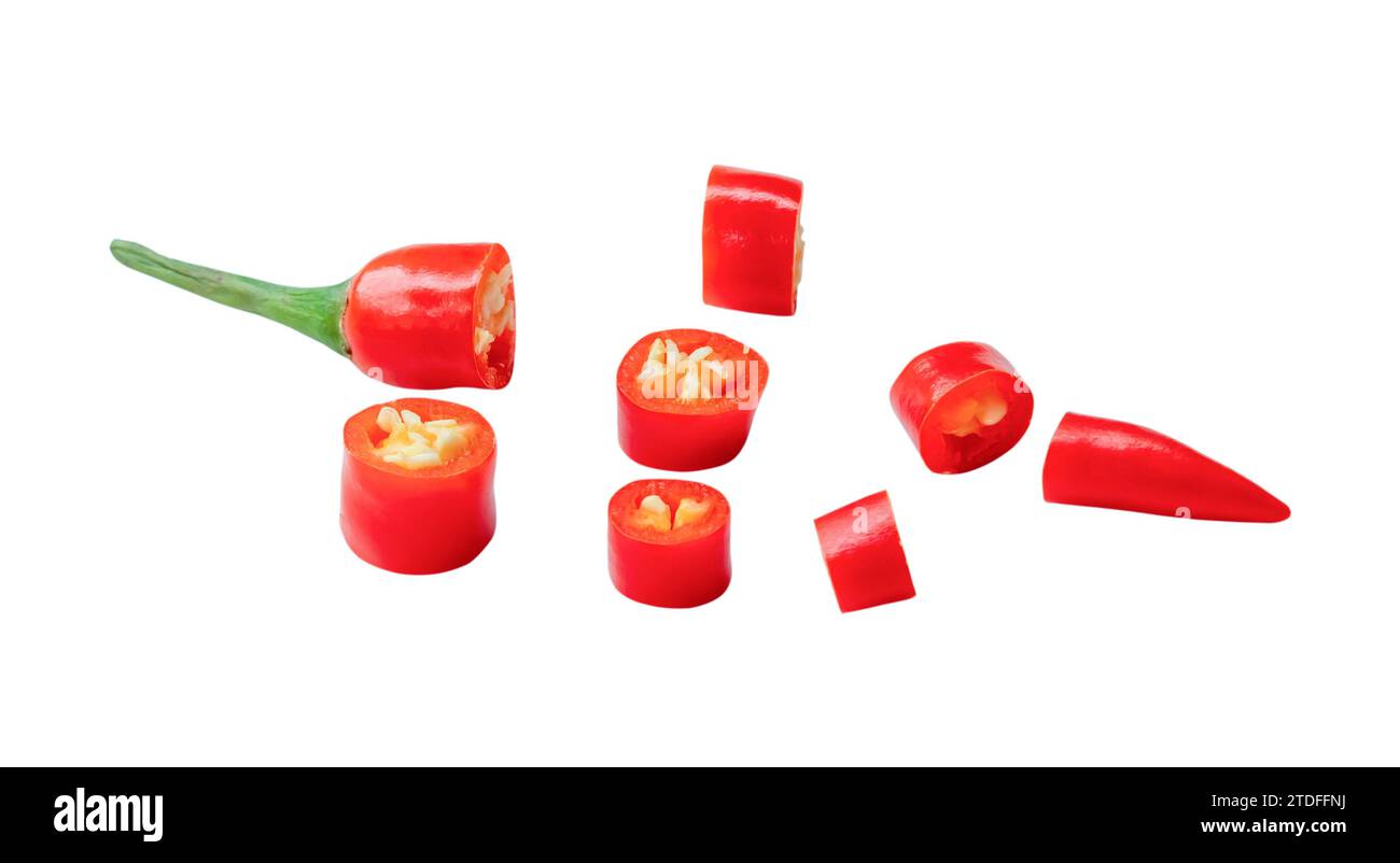 Fresh red chili pepper slices are isolated on white background with clipping path. Top view and flat lay Stock Photo