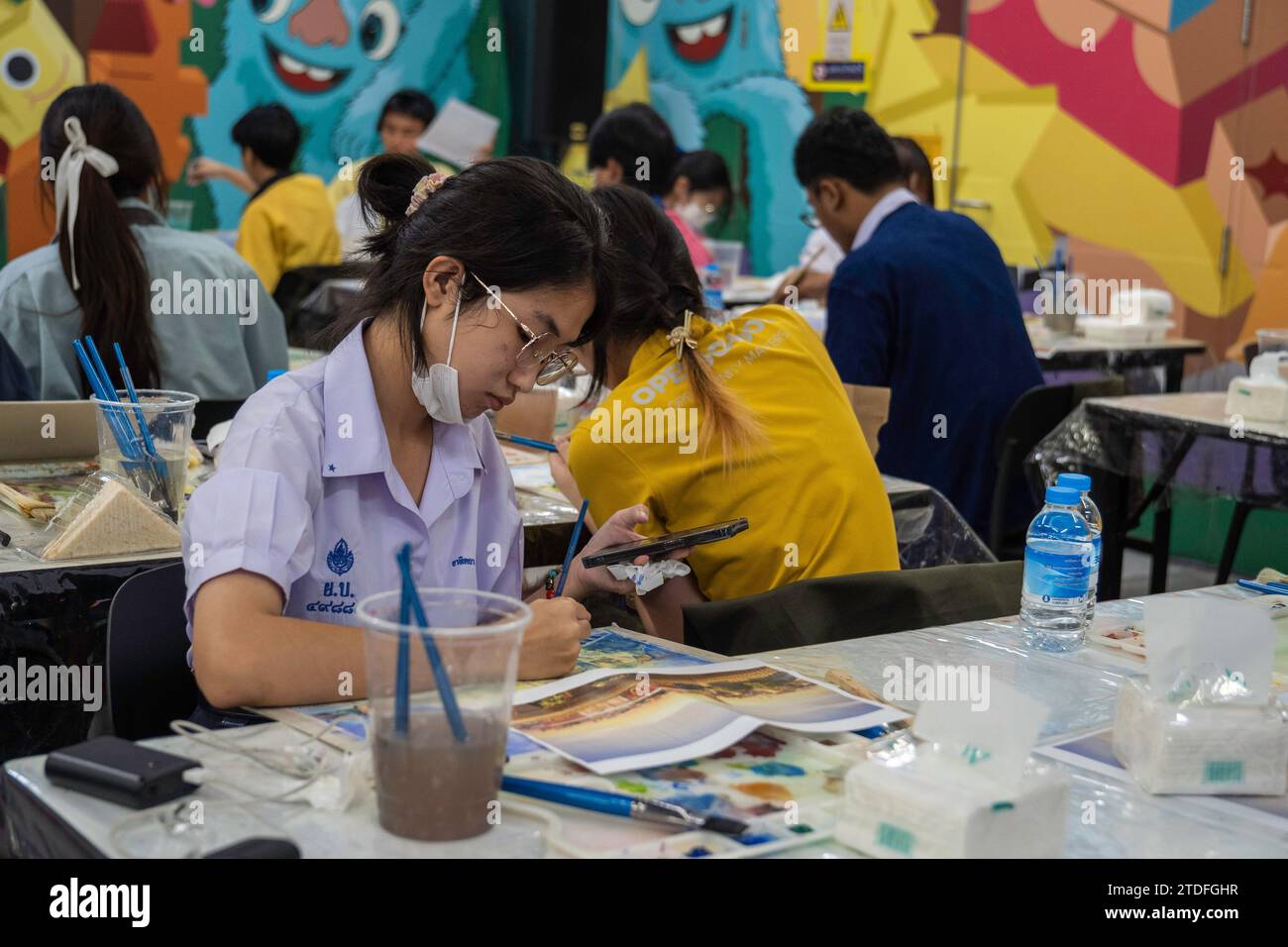 Bangkok, Thailand. 8th Dec, 2023. A Thai student is seen painting with watercolors at the 'BEM Art Contest'' watercolor painting contest, at MRT Phahon Yothin station. The 'Metro Art'' at the MRT Phahon Yothin, developed by Bangkok Expressway and Metro Public (BEM), Bangkok Metro Networks Limited (BMN), and supported by the Tourism Authority of Thailand (TAT) is the new Art Space and Art Destination in the city's heart as the MRT Phahon Yothin station connects to all areas of Bangkok, where visitors can learn arts in various fields, shop and sell works of art. (Credit Image: © Nathal Stock Photo