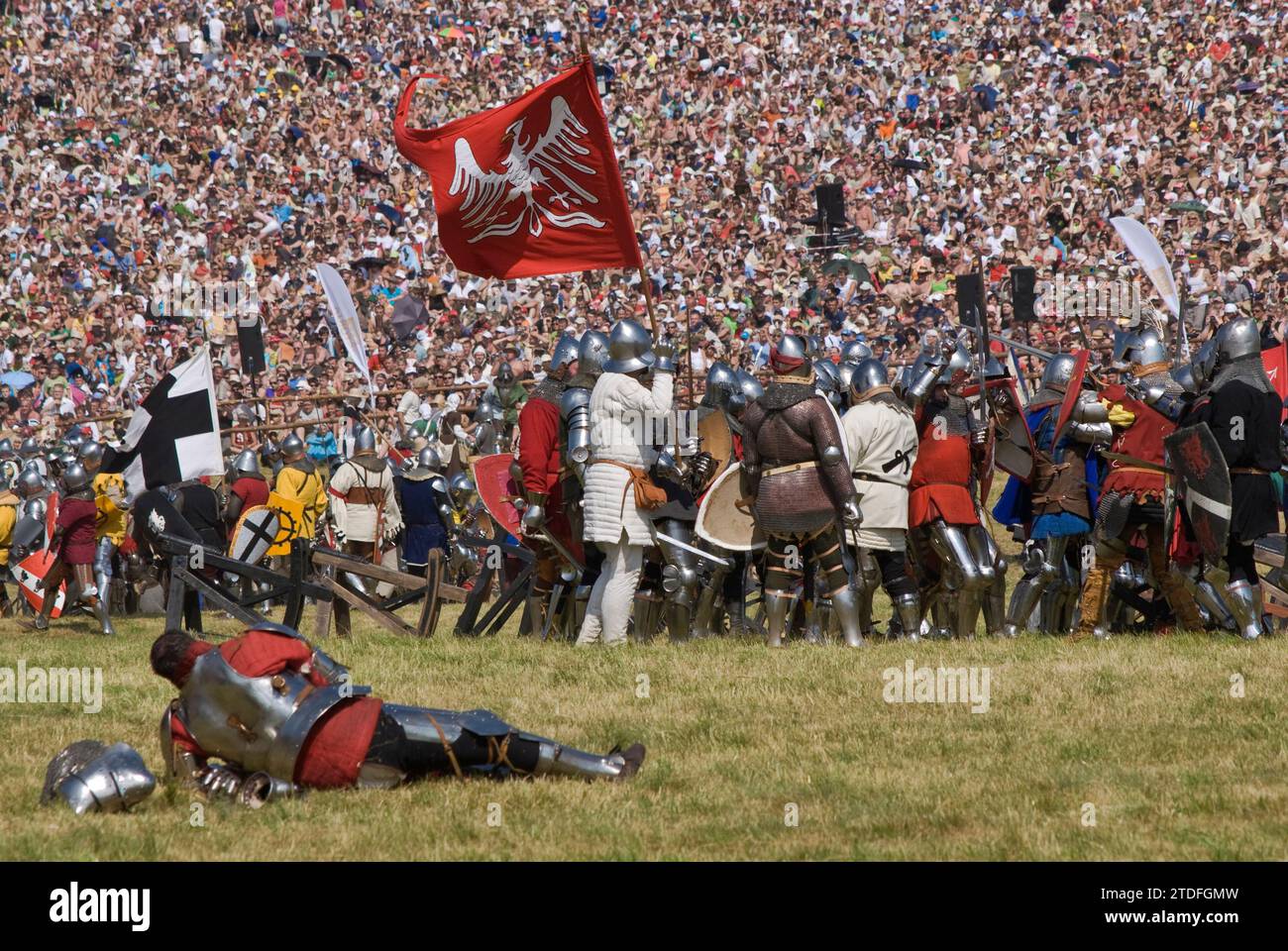 Reenactors and spectators at annual recreation of Battle of Grunwald which took place in 1410 when Polish and Lithuanian troops broke the power of Teutonic Knights, near village of Grunwald Warminsko-Mazurskie, Poland Stock Photo