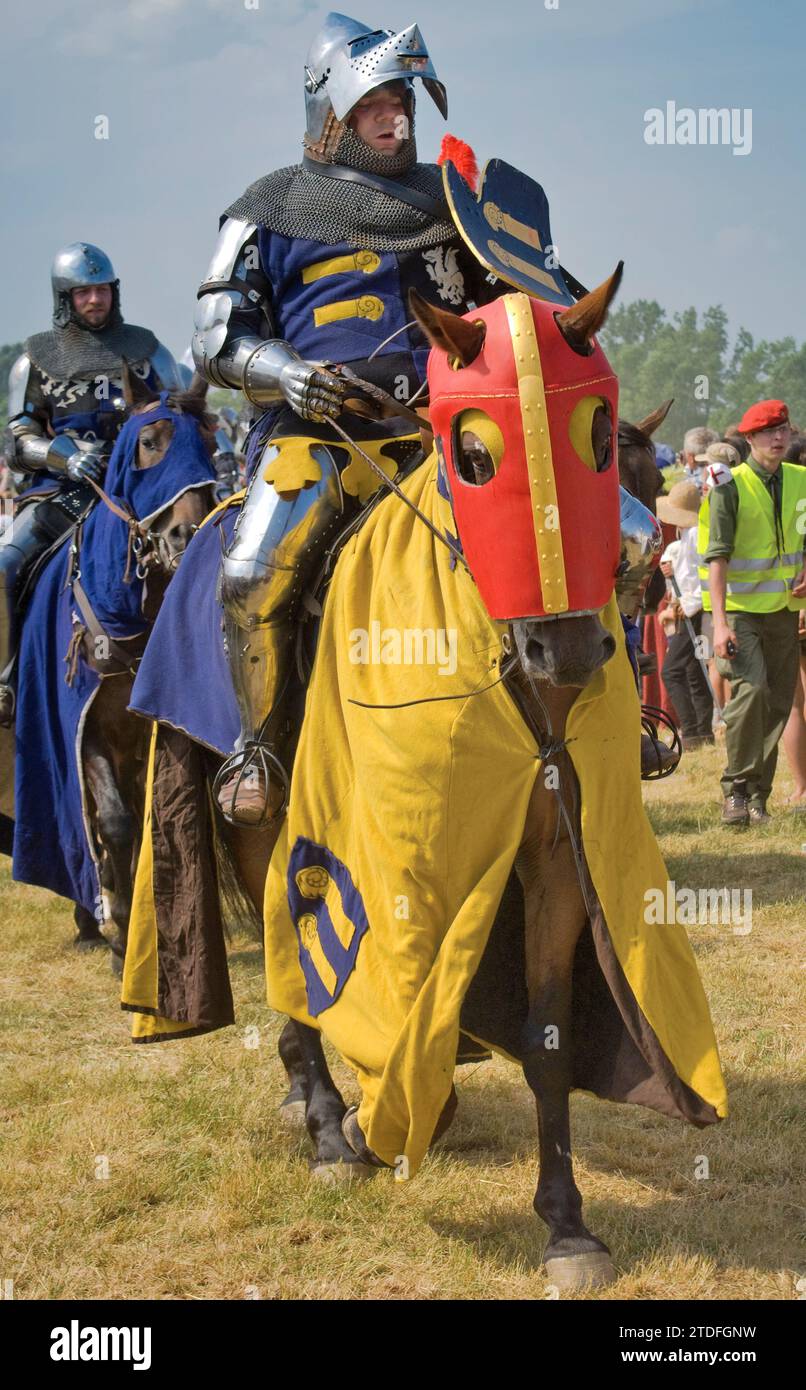 Reenactors leaving battlefield after recreating Battle of Grunwald which took place in 1410 when Polish and Lithuanian troops broke the power of Teutonic Knights, near village of Grunwald Warminsko-Mazurskie, Poland Stock Photo
