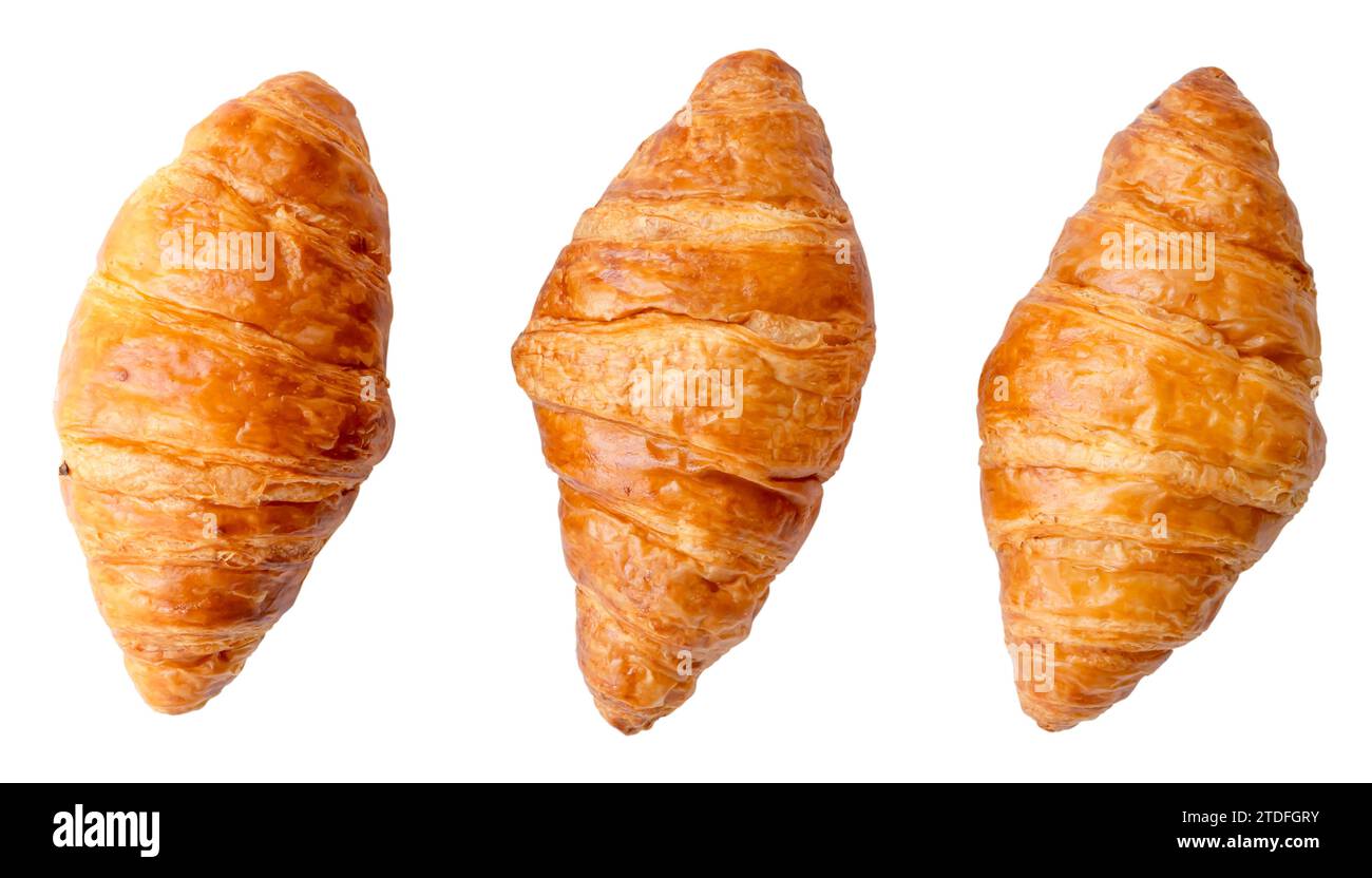 Top view of three separated fresh croissants in set is isolated on white background with clipping path. Stock Photo