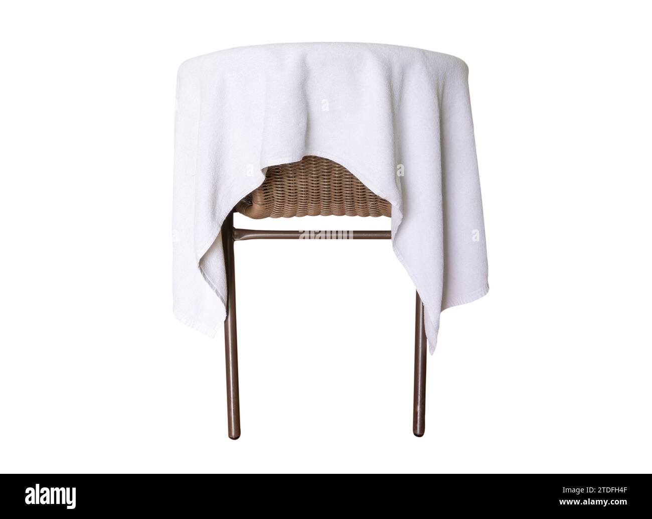 Used white towel laying on chair is isolated on white background with clipping path Stock Photo