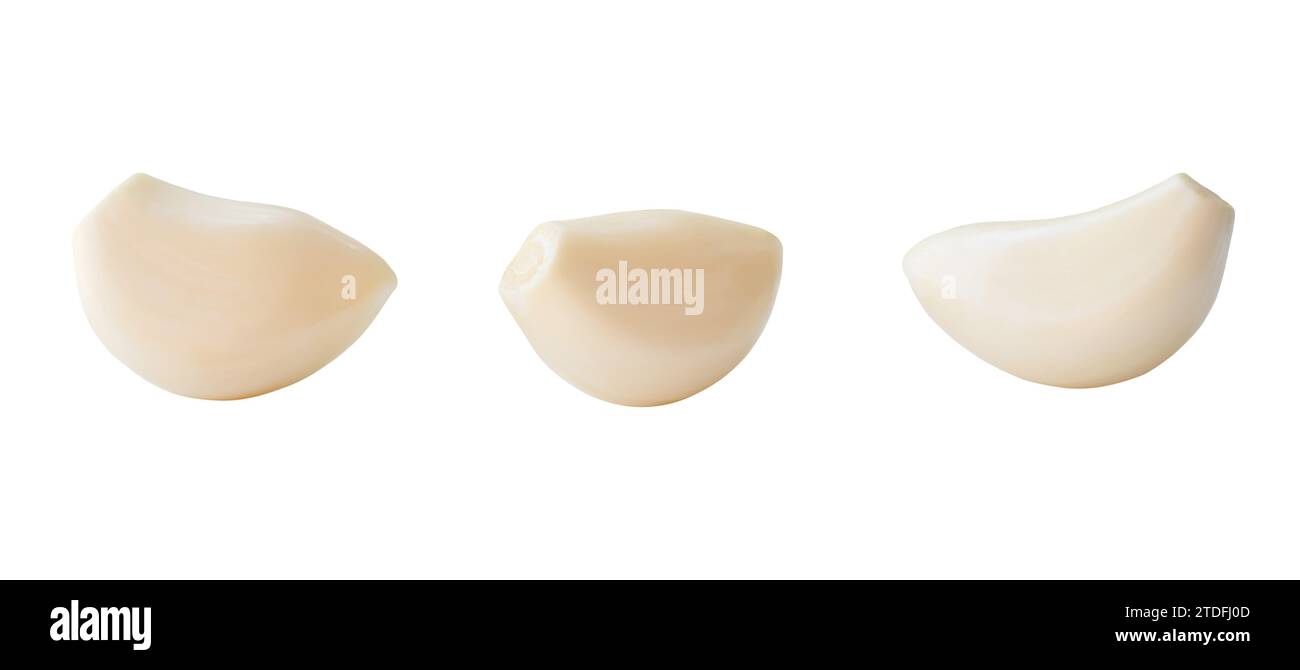 Set of three separated peeled garlic cloves is isolated on white ...