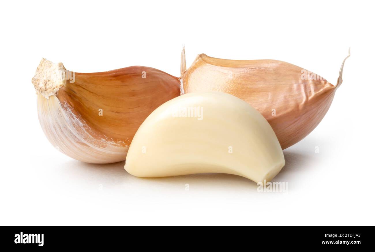 Peeled garlic cloves in stack are isolated on white background with ...