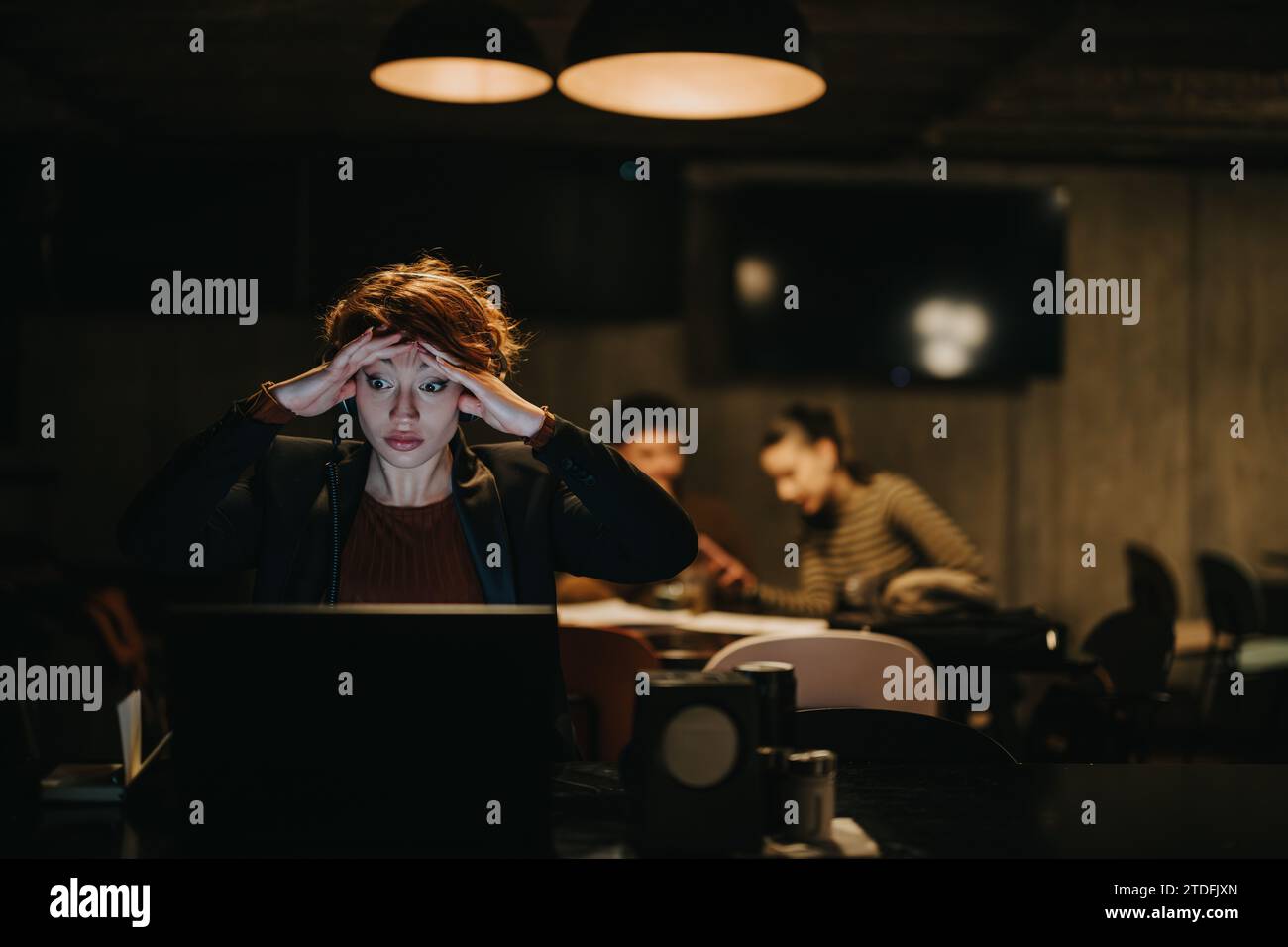 Confident businesswoman discussing data analytics for financial optimization in a creative office. Stock Photo