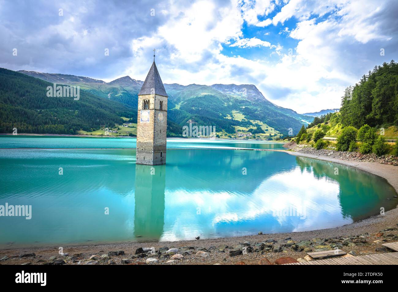 Submerged bell Tower of Curon Venosta or Graun im Vinschgau on Lake Reschen landscape view, South Tyrol region Italy Stock Photo