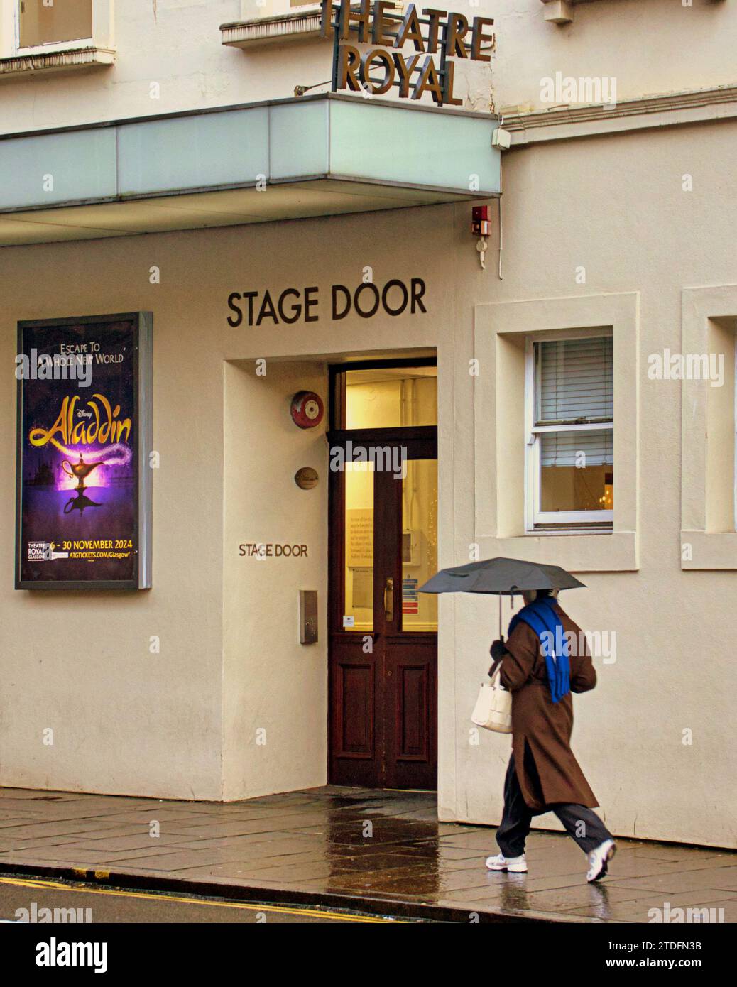 Glasgow, Scotland, UK. 18th December, 2023. UK Weather:  Cloudy  saw a miserable wet day in the city centre for Christmas week.  Aladdin is the pantomime on at the theatre royal. Credit Gerard Ferry/Alamy Live News Stock Photo