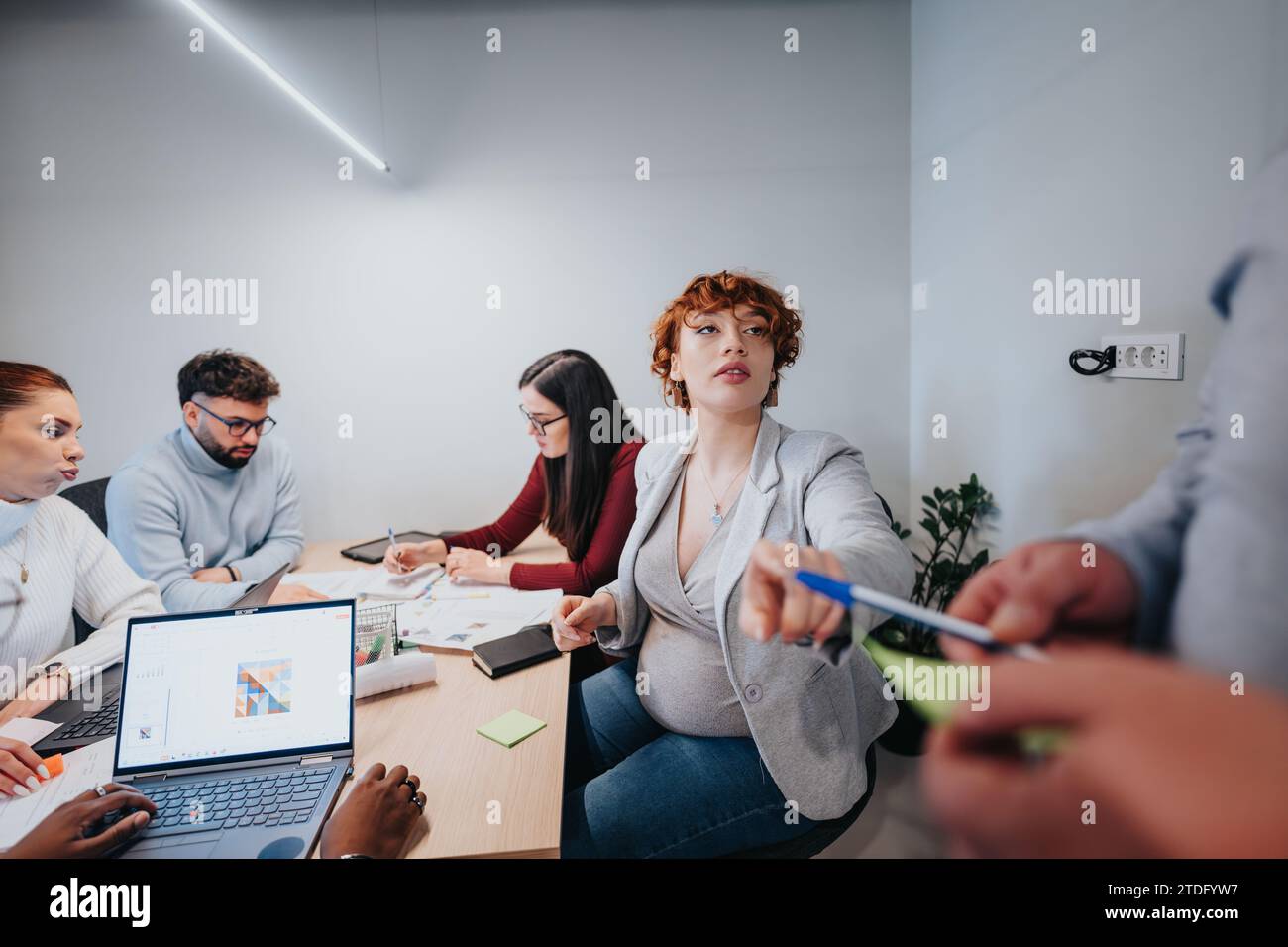 Business professionals collaborating in a creative office. Stock Photo