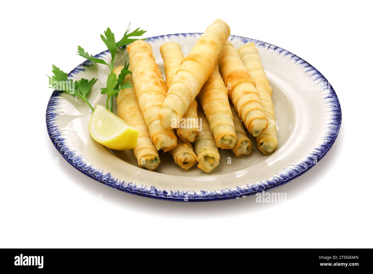 Sigara borek, Cigar-like Turkish spring rolls. A dough sheet called yufka wrapped with cheese filling and fried. Stock Photo