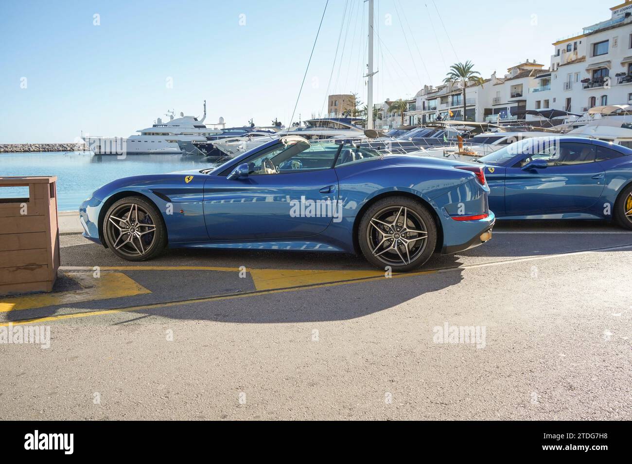 Ferrari parked in luxury Port of Puerto Banus, Marbella, Costa del Sol, Spain. Stock Photo