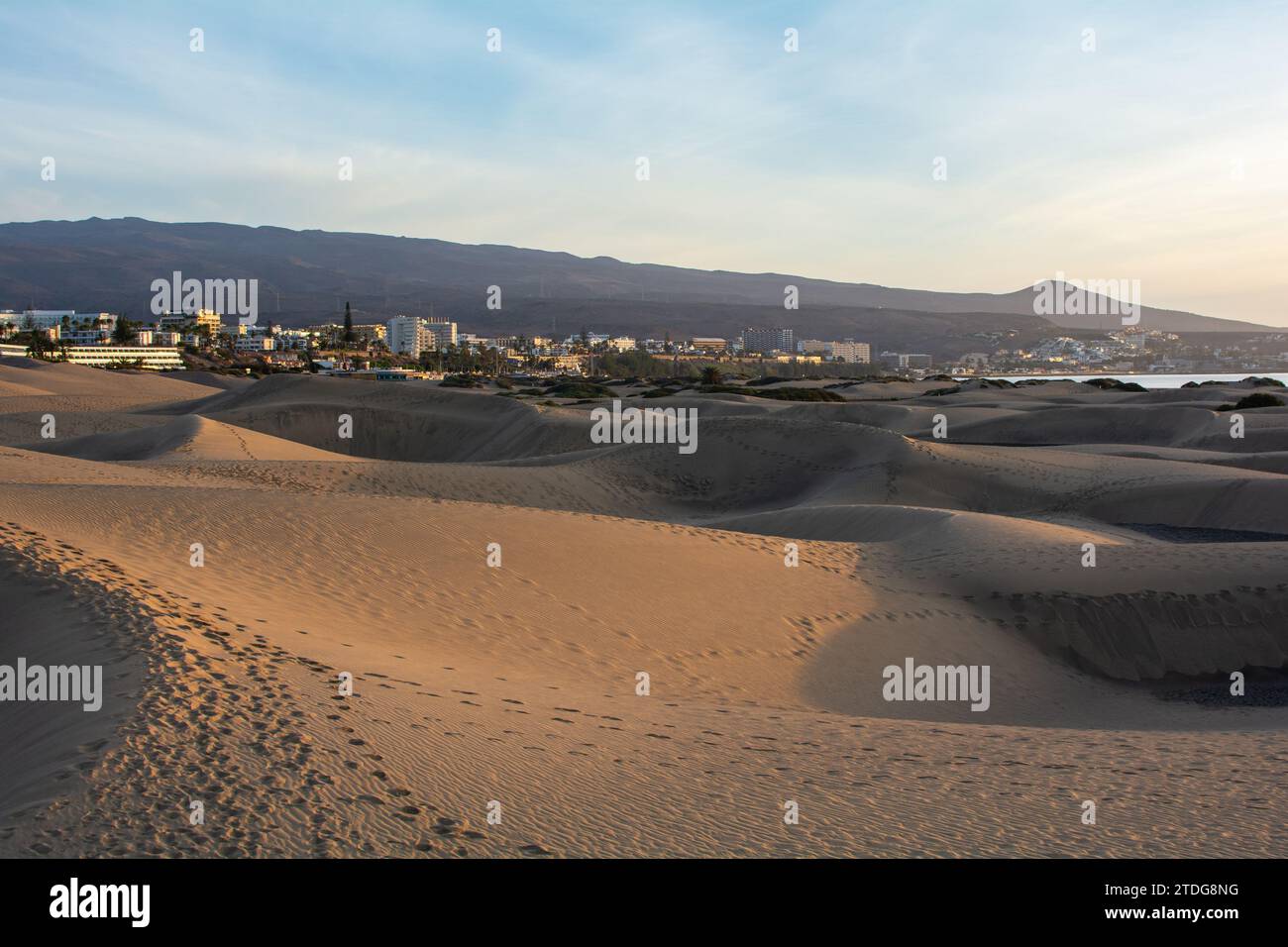 Sand dunes of Maspalomas with a view to the town of Playa del Inglés on the Canary Island of Gran Canaria, Spain, Europe. The huge sand dunes resemble Stock Photo