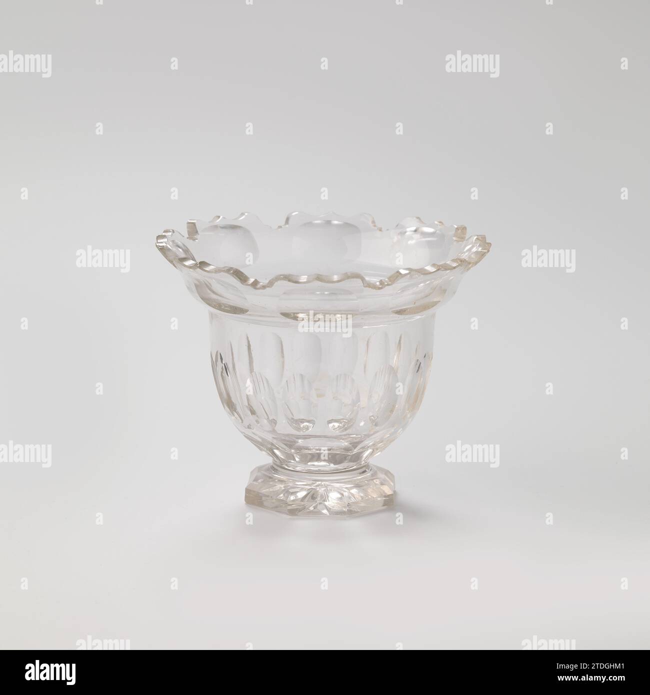 Sugar bowl of cut crystal on octagonal base, anonymous, c. 1881 Round sugar bowl of sharpened crystal. The pot rests on an octagonal base. The ball -walled barrel has a sloping scalloped top edge. With lid (BK-1981-12-B-2). Netherlands (possibly) crystal (lead glass) Round sugar bowl of sharpened crystal. The pot rests on an octagonal base. The ball -walled barrel has a sloping scalloped top edge. With lid (BK-1981-12-B-2). Netherlands (possibly) crystal (lead glass) Stock Photo