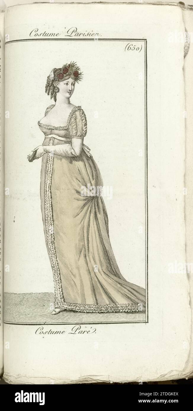 Journal of the ladies and fashions, Parisian costume, 1805, year 13 (650) Péré costume, Horace Vernet, 1805 Lady in beige Avondjapon with deep cleavage and sleep. In the hand a folded fan. Hairstyle decorated with red flower wreath,  paper engraving Lady in beige Avondjapon with deep cleavage and sleep. In the hand a folded fan. Hairstyle decorated with red flower wreath,  paper engraving Stock Photo