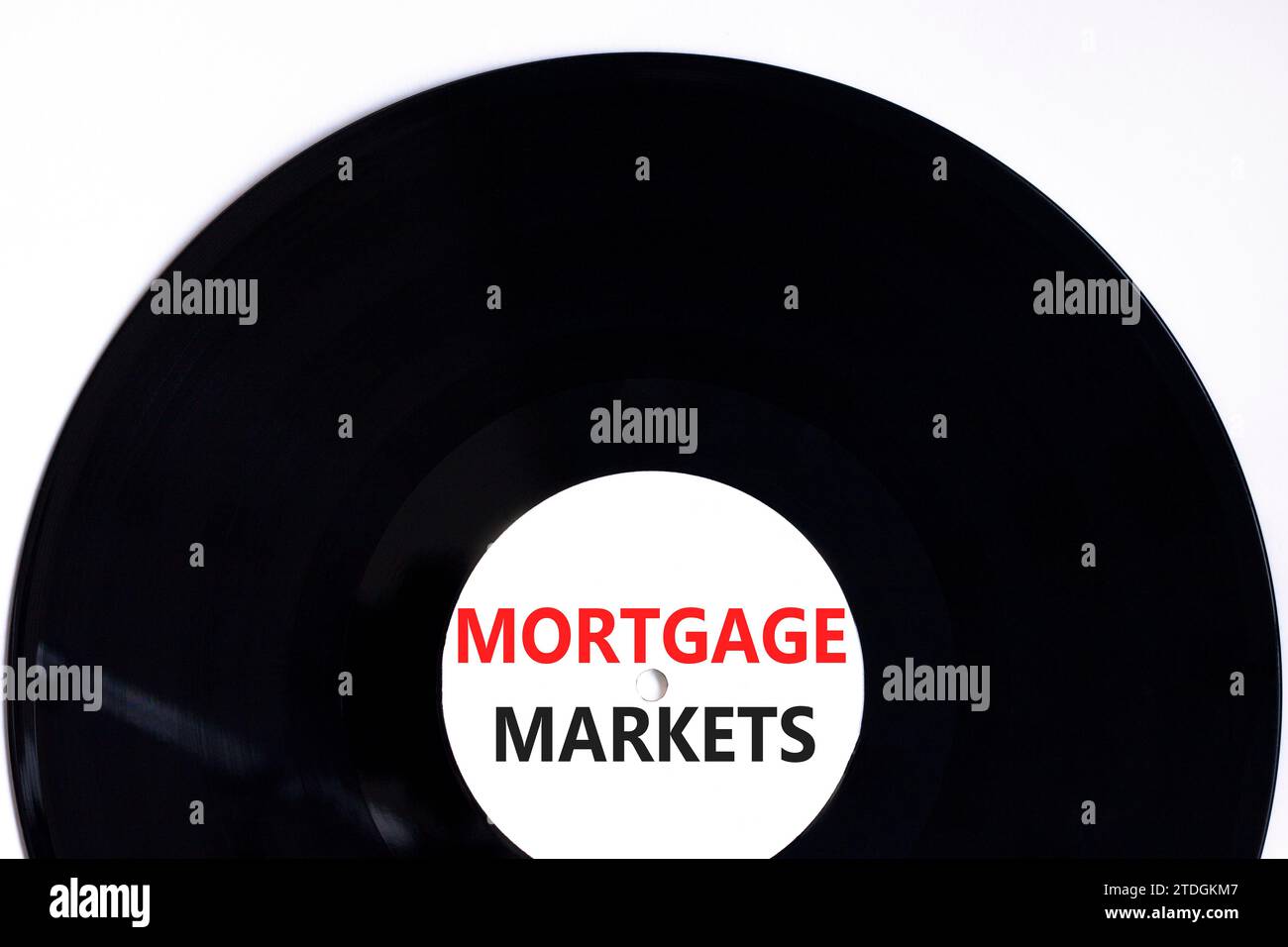 Mortgage markets symbol. Concept words Mortgage markets on beautiful black vinyl disk. Beautiful white table white background. Business mortgage marke Stock Photo