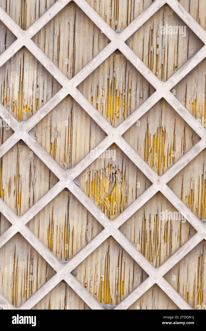 Abstract, white, wooden lattice in a diamond patter overlaid on a