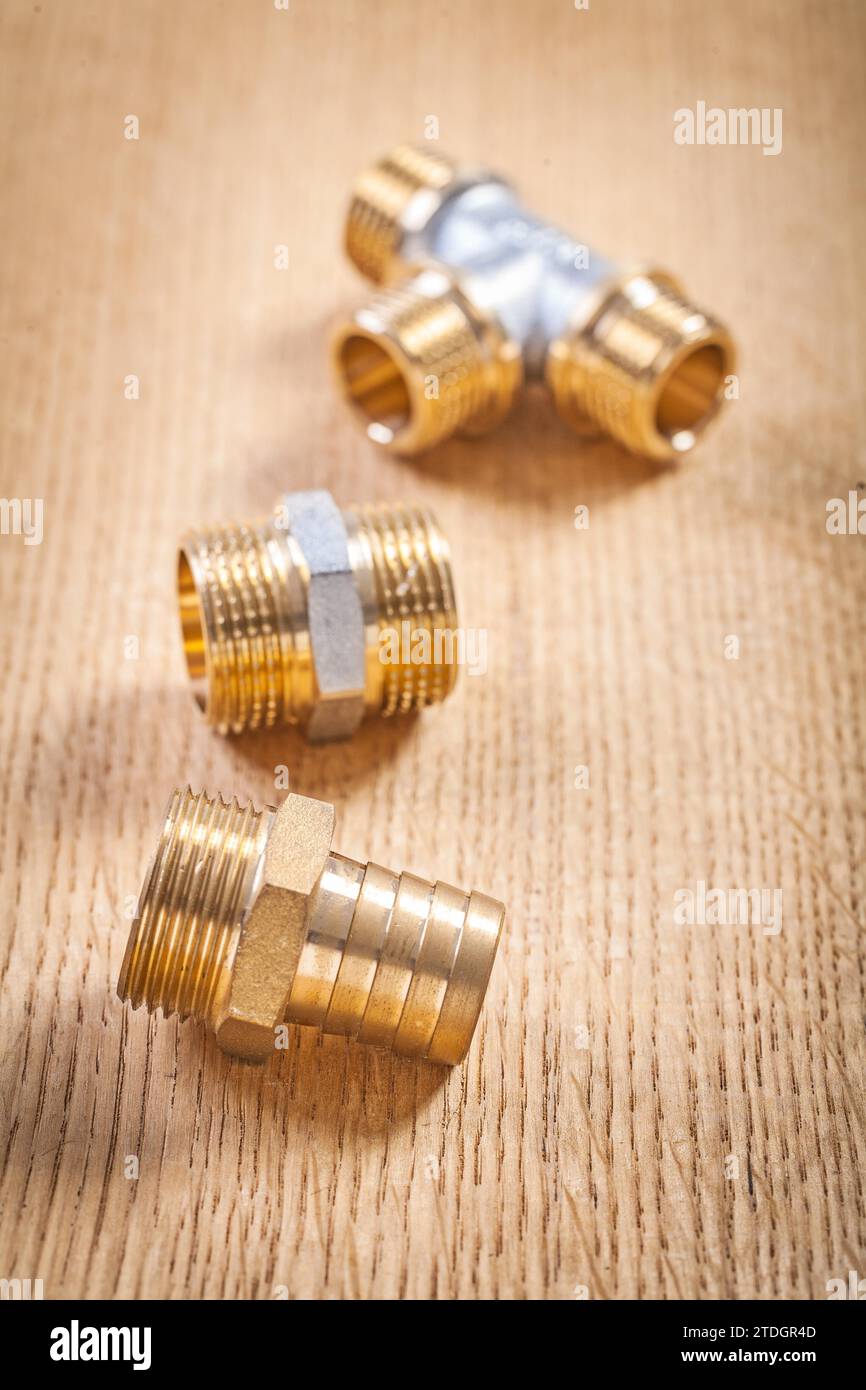 Three sanitary fittings on wooden panel Stock Photo Alamy