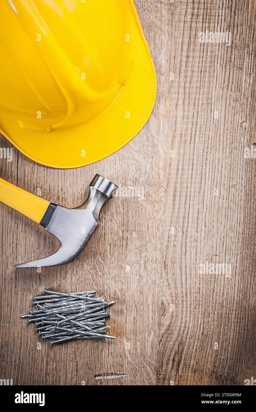 Claw hammer Construction nails Construction helmet on wooden board Stock Photo Alamy