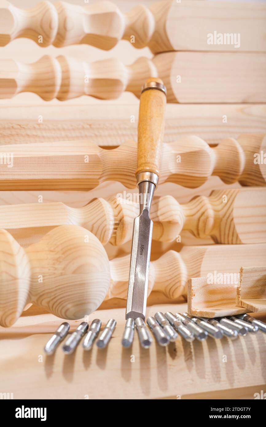 Carpenter's chisel and wooden figure Stock Photo Alamy