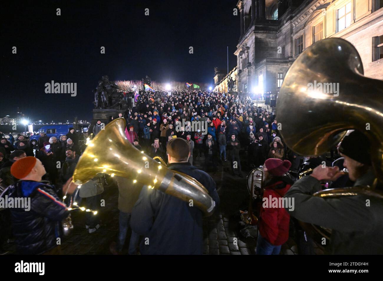 Dresden, Germany. 18th Dec, 2023. Participants in a counter-demonstration organized by the 'Herz statt Hetze' initiative take part in the protest against an announced demonstration by the right-wing extremist movement Pegida at Schlossplatz. Credit: Robert Michael/dpa/Alamy Live News Stock Photo