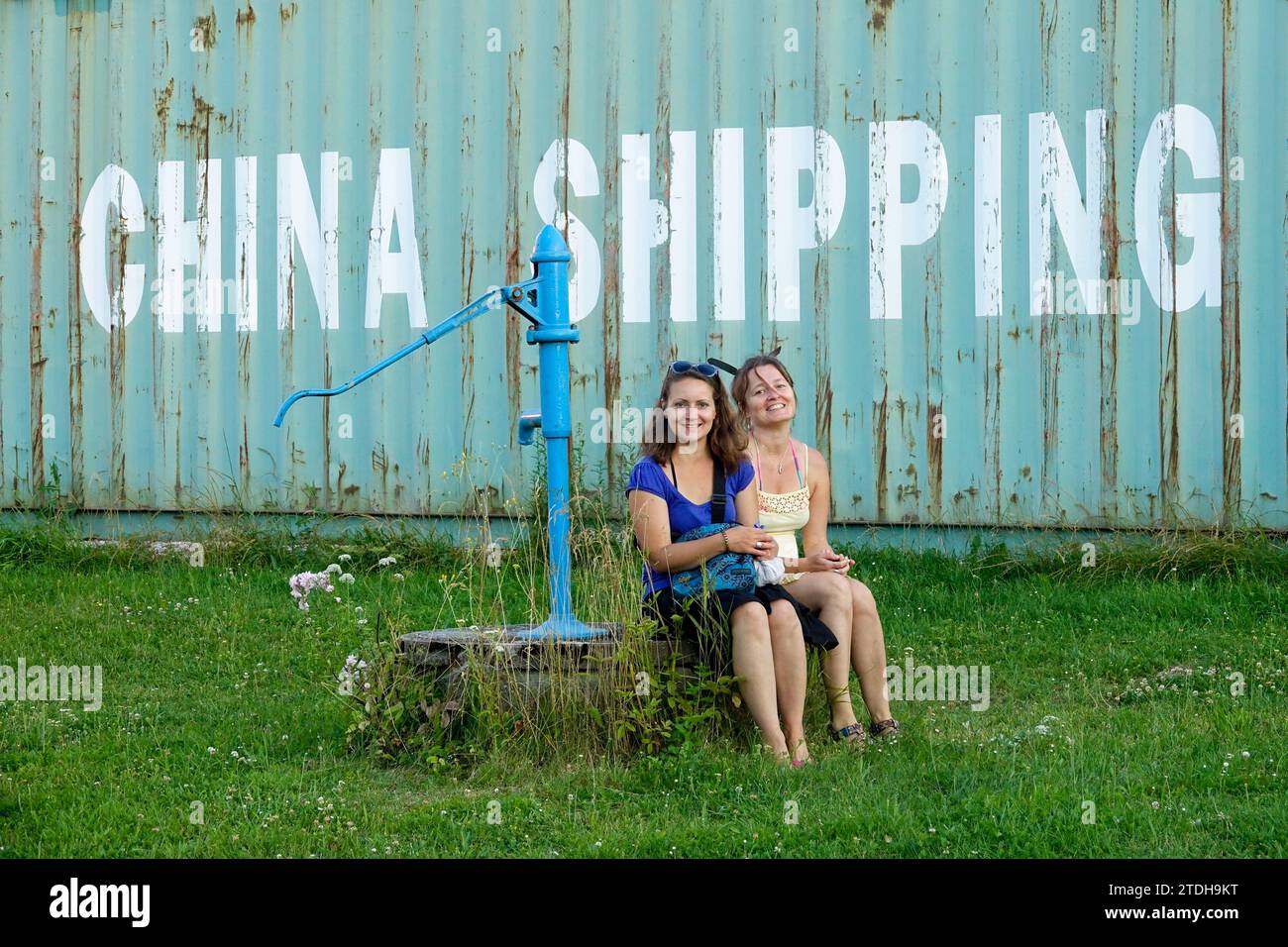 Two women in front of a container China shipping Stock Photo