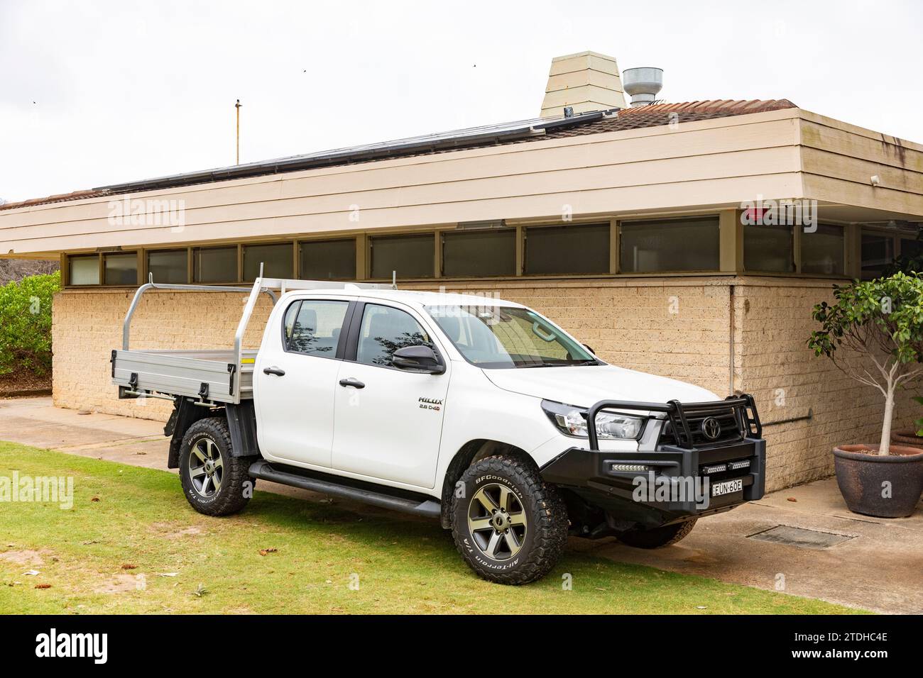 white Toyota Hilux flat bed utility vehicle ute in Palm Beach,Sydney