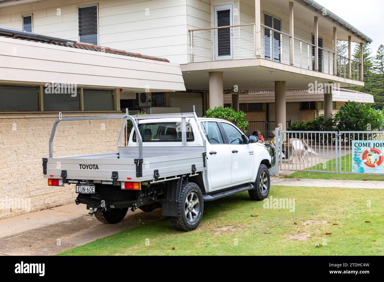 white Toyota Hilux flat bed utility vehicle ute in Palm Beach,Sydney