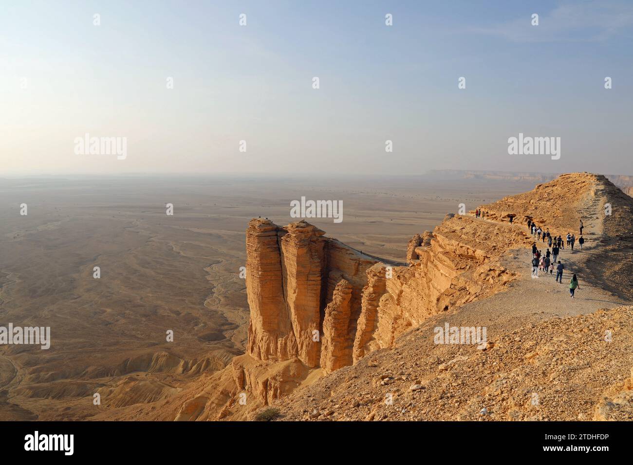 Tourists arriving for sunset at the Edge of the World in the desert of Saudi Arabia Stock Photo