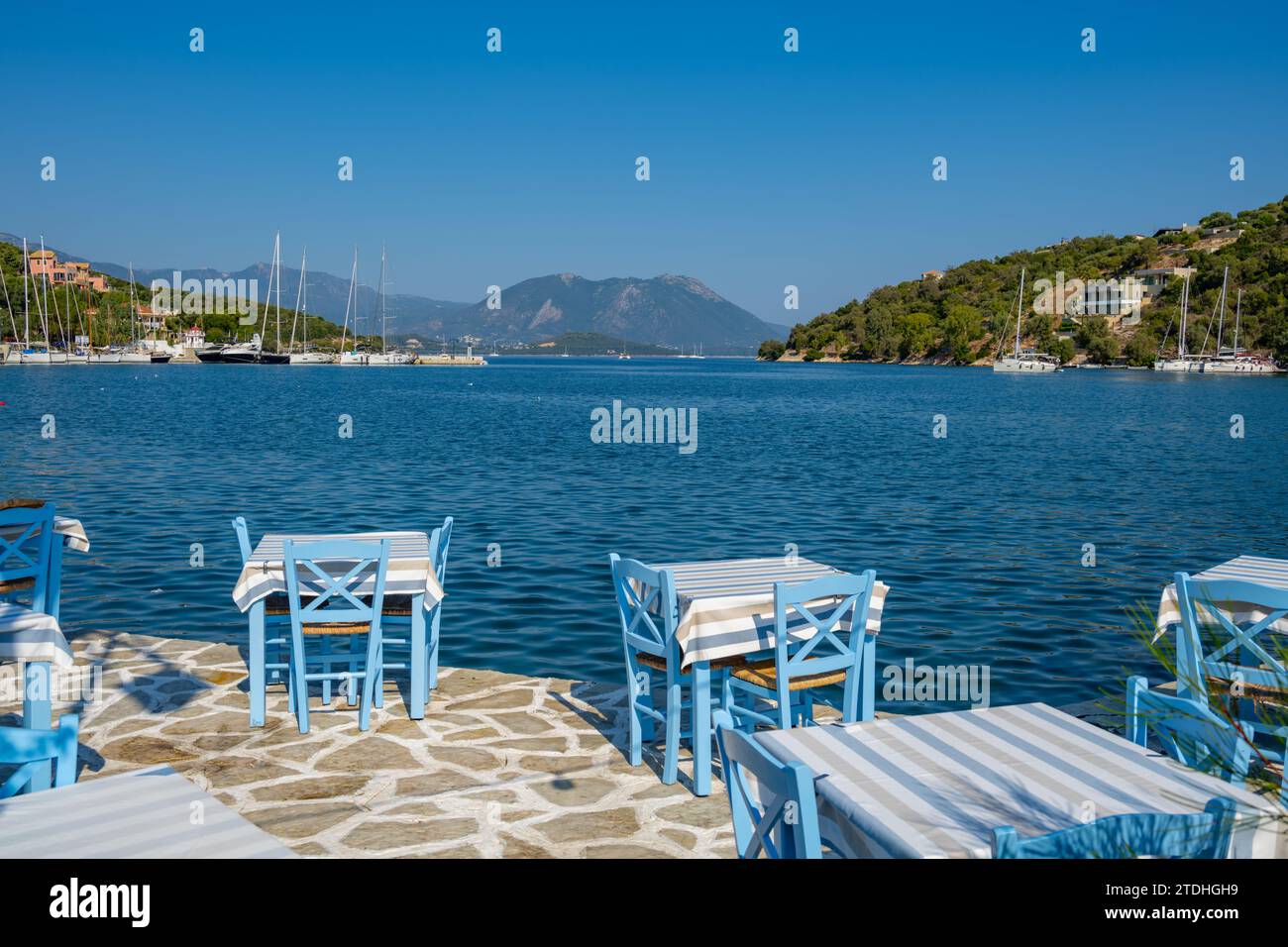 Yachts moored in the harbour of Vathi on the island of Meganisi in the Ionian Sea Stock Photo